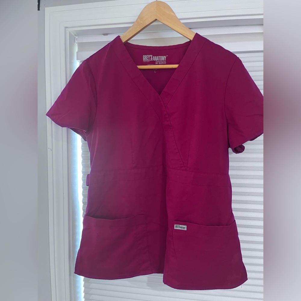 Greys Anatomy dark pink scrub top.